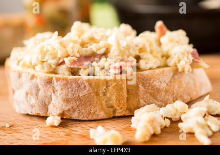 Sandwich, tapas with scrambled eggs and ham Stock Photo