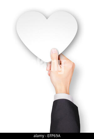 Hand of a man holding a heart shaped paper Stock Photo