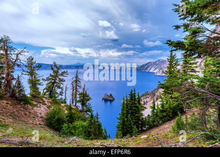 Looking down on Crater Lake and the island called the Phantom Ship. Crater Lake National Park, Oregon, United States. Stock Photo