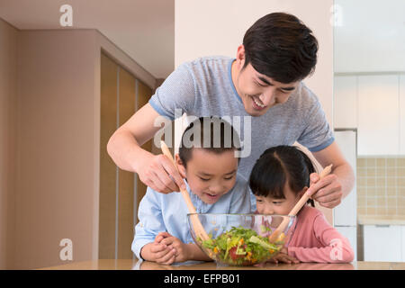 Father cooking with children Stock Photo