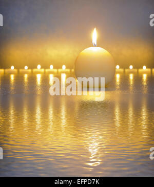 Japanese ZEN garden with candle lights mirroring in water Stock Photo