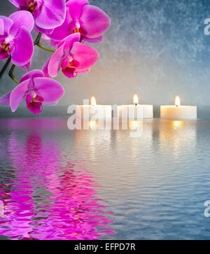 Japanese ZEN garden with candle lights mirroring in water Stock Photo