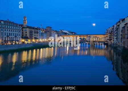 Ponte Vecchio bridge over the River Arno and full moon, Florence, UNESCO World Heritage Site, Tuscany, Italy, Europe Stock Photo