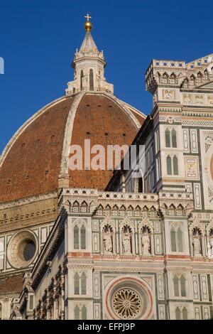 A vertical shot of Santa Maria del Pi gothic church tower with the flag ...