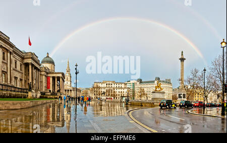 London, United Kingdom - April 12, 2013: rainbow over Trafalgar Square in London. The capital of UK is one of the most popular t Stock Photo