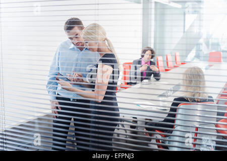 Colleagues using digital tablet Stock Photo