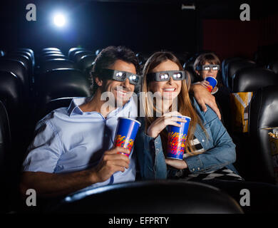 Happy Couple Watching 3D Movie In Theater Stock Photo