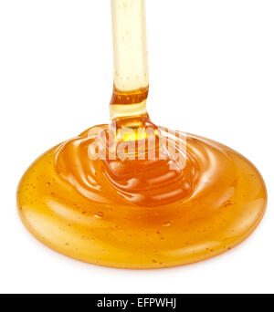 Honey flowing on the white background. Clipping paths. Stock Photo