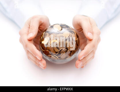 Crystal ball with money in hands Stock Photo