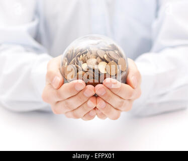 Crystal ball with money in hands Stock Photo