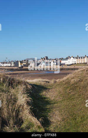 Elie beach at low tide with village through the sand dunes, Elie, East Neuk of Fife, Scotland, U.K. Stock Photo