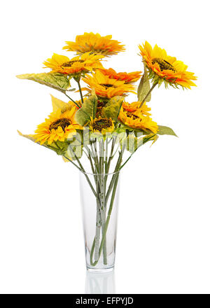 Composition from bright artificial sunflowers in glass vase isolated on white background. Closeup. Stock Photo