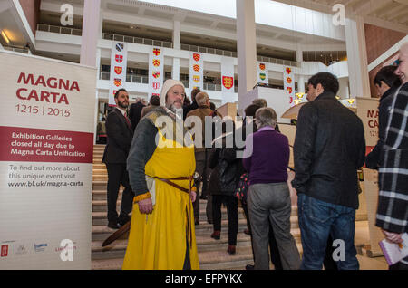 British Library Magna Carta unification. Celebrating the 800th anniversary of Magna Carta marked by the display of the 4 original  documents together for the first time. Copies are from Salisbury, Lincoln cathedrals and the British Library. Visitors were given a waxed sealed certificate memento with their names hand scribed in 'Medieval' style.   1215 people attended the day drawn from ballot of 45000 from around the world. The Magna Carta is still viewed as a hugely significant document enshrining the law as sovereign and so guarding against the tyranny of rulers and mob rule.   This event co Stock Photo