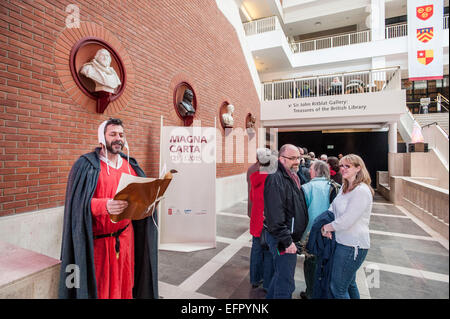 British Library Magna Carta unification. Celebrating the 800th anniversary of Magna Carta marked by the display of the 4 original  documents together for the first time. Copies are from Salisbury, Lincoln cathedrals and the British Library. Visitors were given a waxed sealed certificate memento with their names hand scribed in 'Medieval' style.   1215 people attended the day drawn from ballot of 45000 from around the world. The Magna Carta is still viewed as a hugely significant document enshrining the law as sovereign and so guarding against the tyranny of rulers and mob rule.   This event co Stock Photo