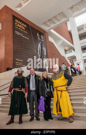 British Library Magna Carta unification. Celebrating the 800th anniversary of Magna Carta marked by the display of the 4 original  documents together for the first time. Copies are from Salisbury, Lincoln cathedrals and the British Library. Visitors were given a waxed sealed certificate memento with their names hand scribed in 'Medieval' style.   1215 people attended the day drawn from ballot of 45000 from around the world. The Magna Carta is still viewed as a hugely significant document enshrining the law as sovereign and so guarding against the tyranny of rulers and mob rule.   This event co Stock Photo