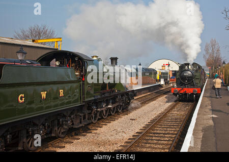 Two Ex GWR loco Nos.2807 & 5553 pass at Williton station with freight trains, West Somerset Railway, England  UK Stock Photo