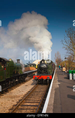 Two Ex GWR loco Nos.2807 & 5553 pass at Williton station with freight trains, West Somerset Railway, England  UK Stock Photo