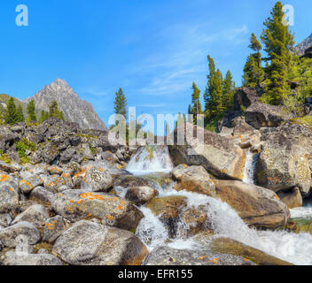 Small cascade of waterfalls on a mountain creek. Eastern Sayan. Buryatia Stock Photo