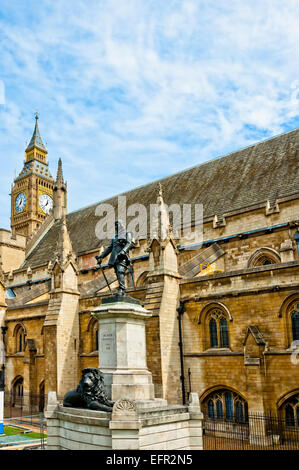 Lord Oliver Cromwell statue outside Palace of Westminster, Houses of Parliament, with Big Ben in the background. London, UK Stock Photo