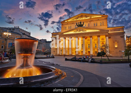 The fountain in front of the Bolshoi Theatre building illuminated at dusk. Moscow, Russia. Stock Photo