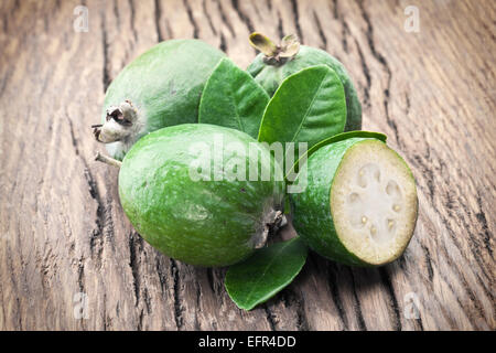 Feijoa fruits on old wooden table. Stock Photo