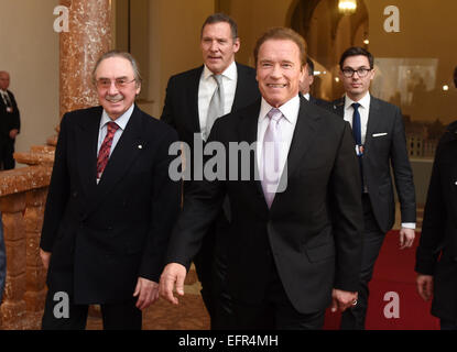 Munich, Germany. 7th Feb, 2015. Former governor of California and actor Arnold Schwarzenegger (front, r) and actor Ralf Moeller (2nd l) arrive for a reception during the 51st Munich Security Conference in Munich, Germany, 7 February 2015. Photo: Tobias Hase/dpa/Alamy Live News Stock Photo