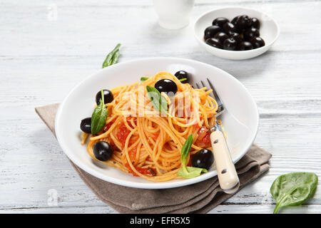 Pasta with olives and basil, food Stock Photo