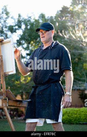 Male plein-air painter in Albin Polasek Museum and Sculpture Garden, Winter Park, Florida, USA Stock Photo
