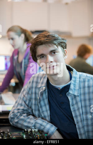 Two people in a computer repair shop. Technicians, young people working to repair computers. Stock Photo