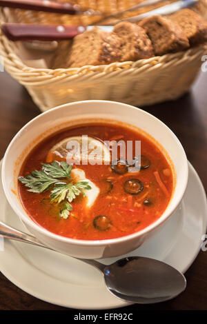 Soup Saltwort With Lemon, Meat, Pickles, Tomato Sauce And Olives In A 