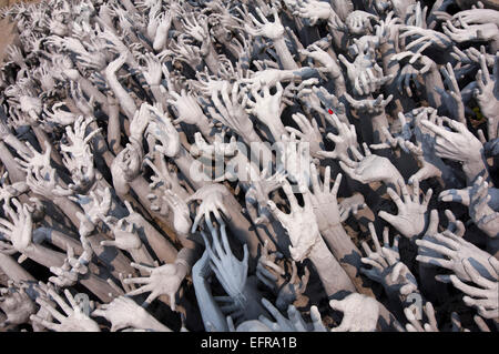 Horizontal view of the hands at Wat Rong Khun, the White Temple, in Chiang Rai. Stock Photo