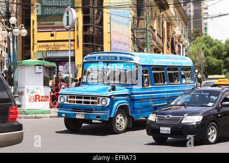 Old blue Dodge D400 bus with other cars on the Plaza del Estudiante (Student's Square) in La Paz, Bolivia Stock Photo