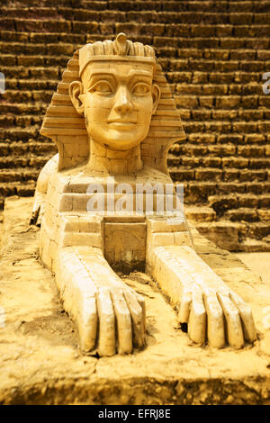 sphinx model close-up with pyramid background Stock Photo