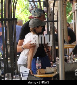 Miranda Cosgrove wearing a t-shirt with the logo 'Always and Forever'  stops for lunch and drinks from a bottle of water before shopping at The Grove in Hollywood  Featuring: Miranda Cosgrove Where: Los Angeles, California, United States When: 07 Aug 2014 Stock Photo