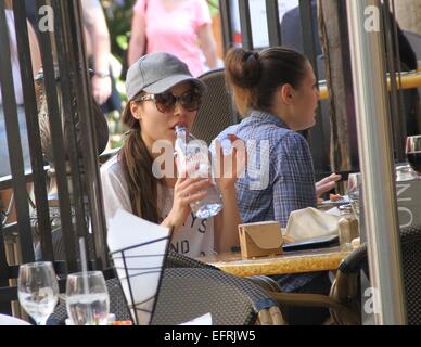 Miranda Cosgrove wearing a t-shirt with the logo 'Always and Forever'  stops for lunch and drinks from a bottle of water before shopping at The Grove in Hollywood  Featuring: Miranda Cosgrove Where: Los Angeles, California, United States When: 07 Aug 2014 Stock Photo