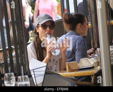 Miranda Cosgrove wearing a t-shirt with the logo 'Always and Forever'  stops for lunch and drinks from a bottle of water before shopping at The Grove in Hollywood  Featuring: Miranda Cosgrove Where: Los Angeles, California, United States When: 07 Aug 2014 Stock Photo