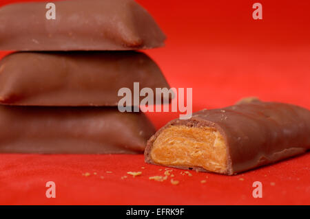 Unwrapped pieces of fun size Butterfinger candy. Stock Photo