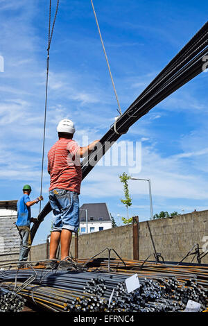 Men working with iron rods at the construction site of bridge, Bhusawal ...