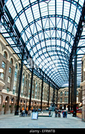 LONDON - APRIL 14, 2013: tourists visit Hay's Galleria in London, UK. Hay's Galleria is a major riverside tourist attraction. Stock Photo