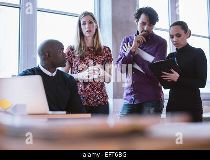 Group of multi ethnic executives working on a project. Business people analyzing statistic. Stock Photo