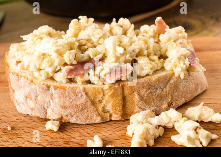 Sandwich, tapas with scrambled eggs and ham Stock Photo