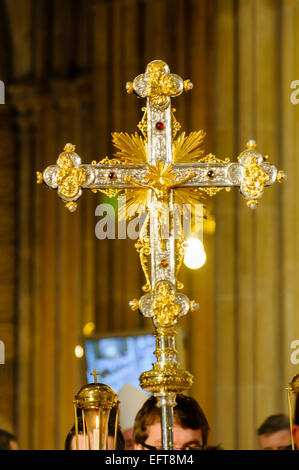 Ornate gold crucifix at a funeral mass. Stock Photo