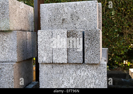 Pile of breeze blocks in garden Stock Photo
