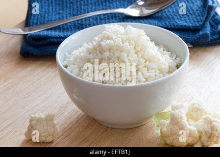 Cauliflower rice - 'rice' made from cauliflower as an alternative to rice. Stock Photo