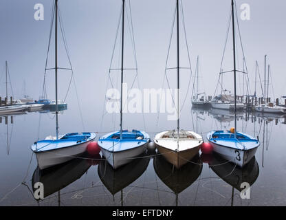 Misty sailing boats on Derwentwater, Keswick, Lake District, Cumbria, England UK Stock Photo