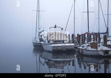 Misty sailing boats on Derwentwater, Keswick, Lake District, Cumbria, England UK Stock Photo