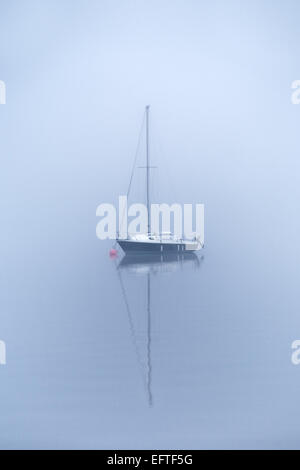 Misty sailing boats on Derwentwater, Keswick, Lake District, Cumbria, England UK Stock Photo