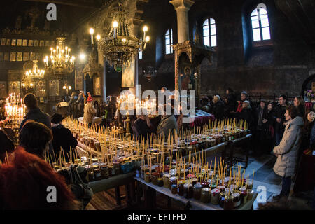 Bulgarian Orthodox Church celebrates the feast of the Holy Hieromartyr Haralambos, who is also worshipped as patron of all beekeepers. Thousands of honey jars and burning candles are arranged in the form of the Holy Cross in the church of the Presentation of the Blessed Virgin in Blagoevgrad, Bulgaria. Honey is consecrated during the Divine Liturgy and it is believed it becomes magical and healing. © Hristo Vladev/Pacific Press/Alamy Live News Stock Photo