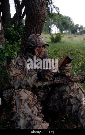 Spring turkey hunter calling turkeys Stock Photo - Alamy