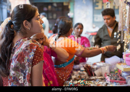 Jodhpur, Rajasthan, India. Women shopping at a jewellery stall in the bazaar Stock Photo